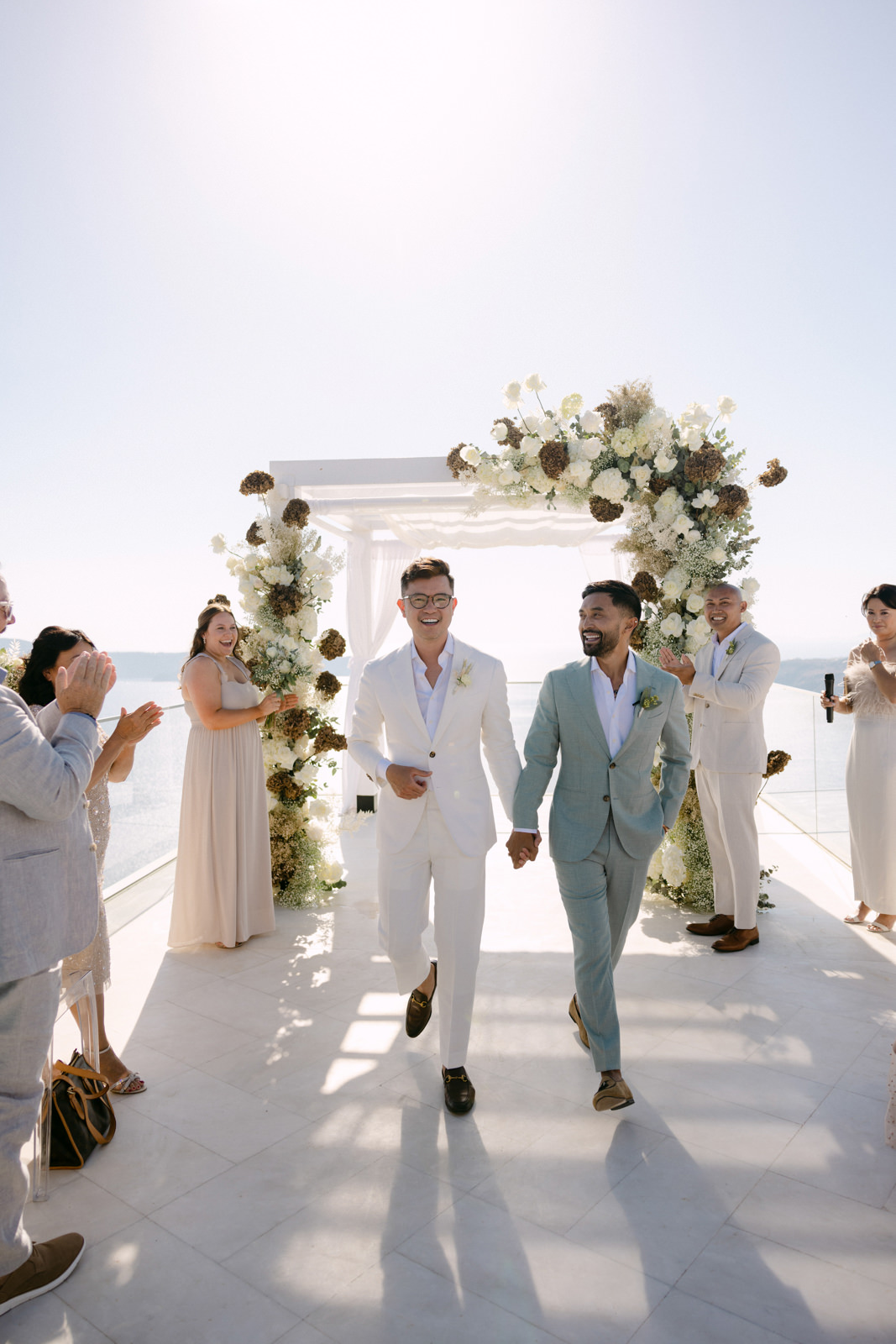 https://annaroussos.com/wp-content/uploads/2023/02/same-sex-wedding-in-santorini-59.jpg